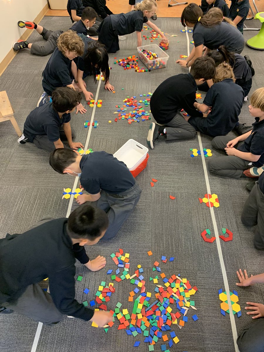 A fun hands-on symmetry lesson! Students worked collaboratively using pattern blocks to create symmetrical shapes. #IBPYP #UBCBEd