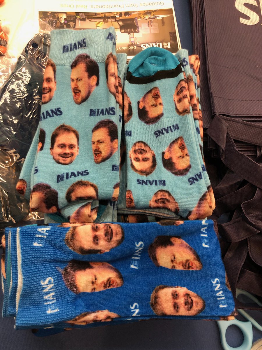 photo of two different varieties of John Strand socks featured at the IANS Research booth at Wild West Hackin Fest Way West.