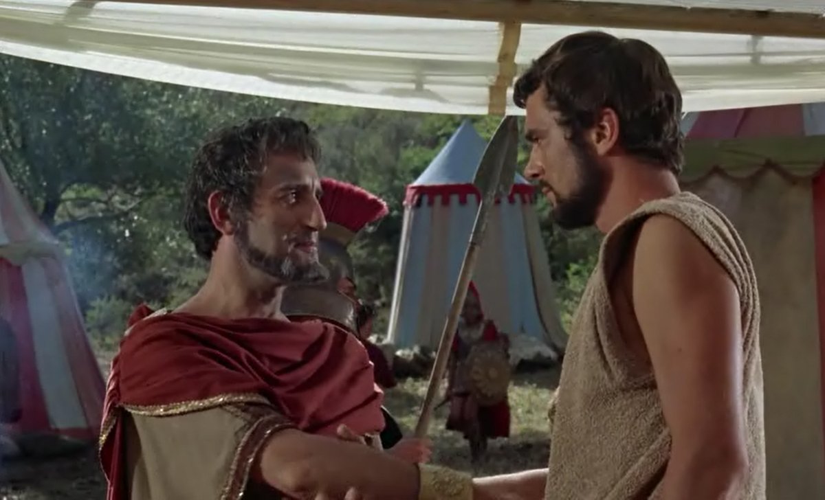 Y así, Jasón le cuenta a ese buen hombre quién es y que quiere destronar a Pelias porque es muy malo...