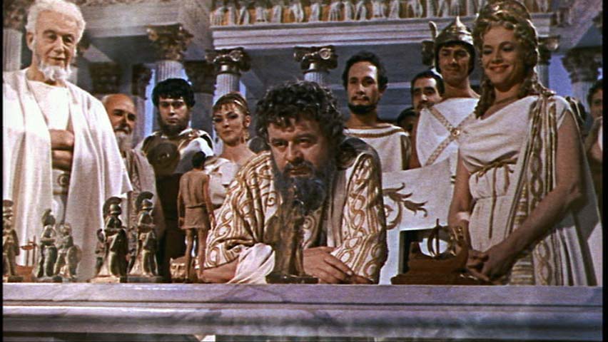Pero el sacerdote del principio está ahí con la oreja puesta, y no es otro que... ¡Hermes! ¡Plot twi...