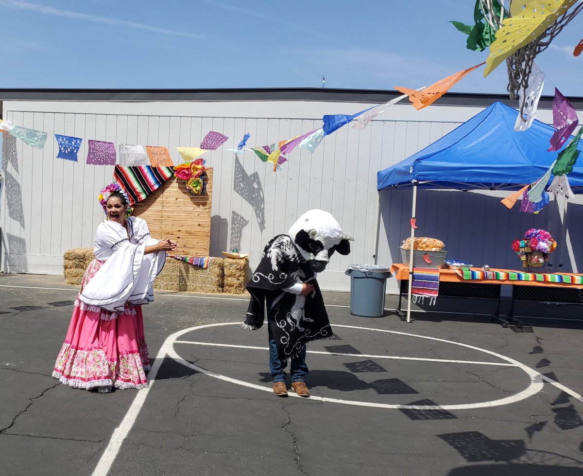 rafer_school's tweet photo. Special visit from Ms. Ramos from @MtVernonEagles she showed different dance styles, taught students a traditional folklore dance, and entice a staff member to participate in a bull dance #CincodeMayo #raferolympians #teambcsd https://t.co/IxLwwvPcyr