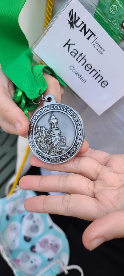 texasphotochick's tweet photo. My girl with her medal. She received the Distinguished Honors College Scholar award at UNT. #UNTCVAD #UNT2022 https://t.co/TI43lcrFnr