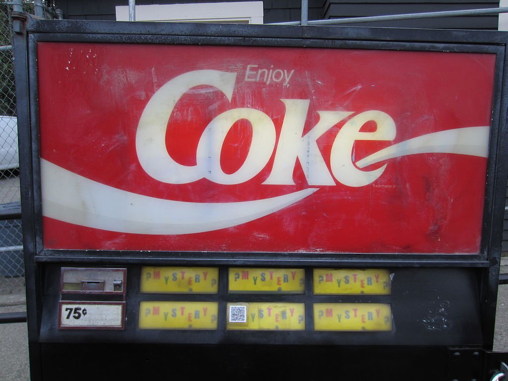 KirbyCheatFurby's tweet photo. apparently there was once this mysterious coke machine stationed in capitol hill from the 1990's to 2018

the machine had a variety of different sodas, and nobody knows who operated it

in 2018, it vanished, and in its spot was some tape that simply reads "went for a walk" https://t.co/thEOtrmo6j