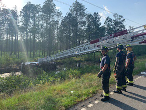 HFD_8's tweet photo. Earlier this afternoon Hardeeville Fire Department responded Mutual Aid to Jasper County Fire-Rescue on Deerfield Rd for a MVC with a vehicle in the canal. Truck-84 assisted with getting the patients safely removed from the incident. @jasperscfire https://t.co/89ZgI8VXUE