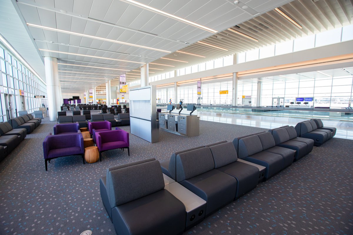 DENAirport's tweet photo. Today, DEN team members, @MayorHancock, @SouthwestAir &amp; partners officially cut the ribbon celebrating the opening of the east side of Concourse C: including 16 new gates, an outdoor deck, comfy seating, charging stations, restrooms, nursing rooms a pet relief area &amp; so much more https://t.co/wvFVaJ0MG9