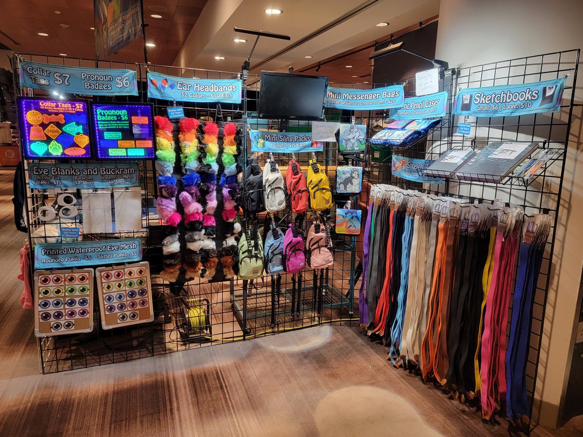FursuitSupplies's tweet photo. Our biggest booth ever is all set up at @FurryWeekend! Come by and see us starting at 10am tomorrow at table 158 and browse our huge selection of goodies, including kigurumi, paws, balaclavas, cooling fans, and of course, faux fur fabrics! #FWA2022 https://t.co/diEWIjWHuI