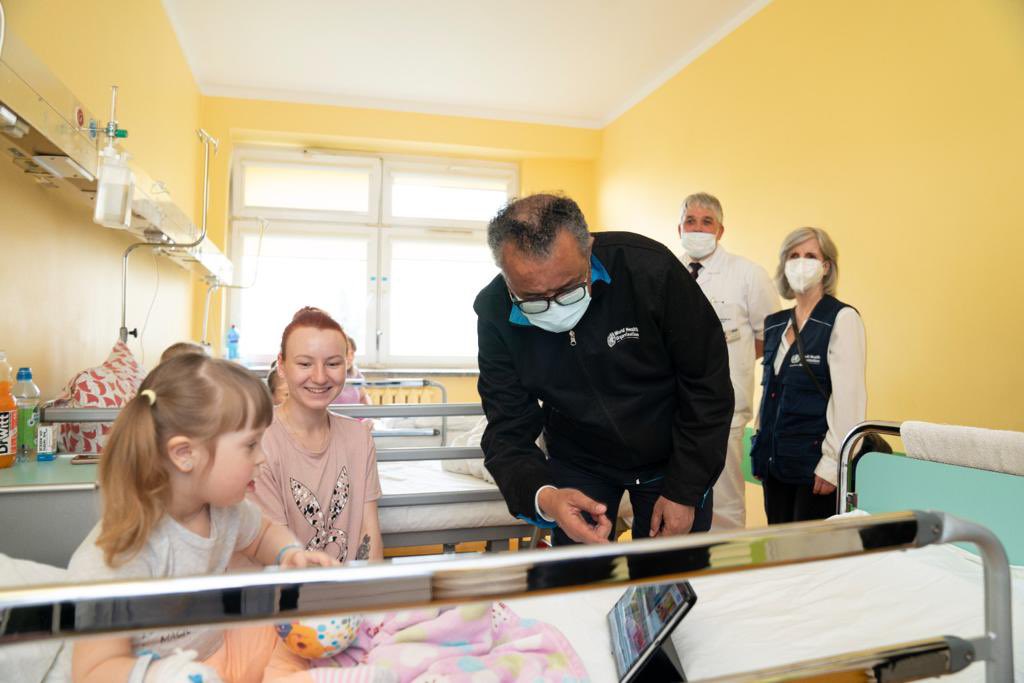 DrTedros's tweet photo. I met Alexandra, a refugee from the Kyiv area. Her daughter Yeava, who has Down Syndrome, is being treated for bronchitis. In #Ukraine they hid in shelters and then made their way to 🇵🇱. Grateful to kind volunteers at the Polish border and workers at the hospital. https://t.co/aXC0qfGkKR