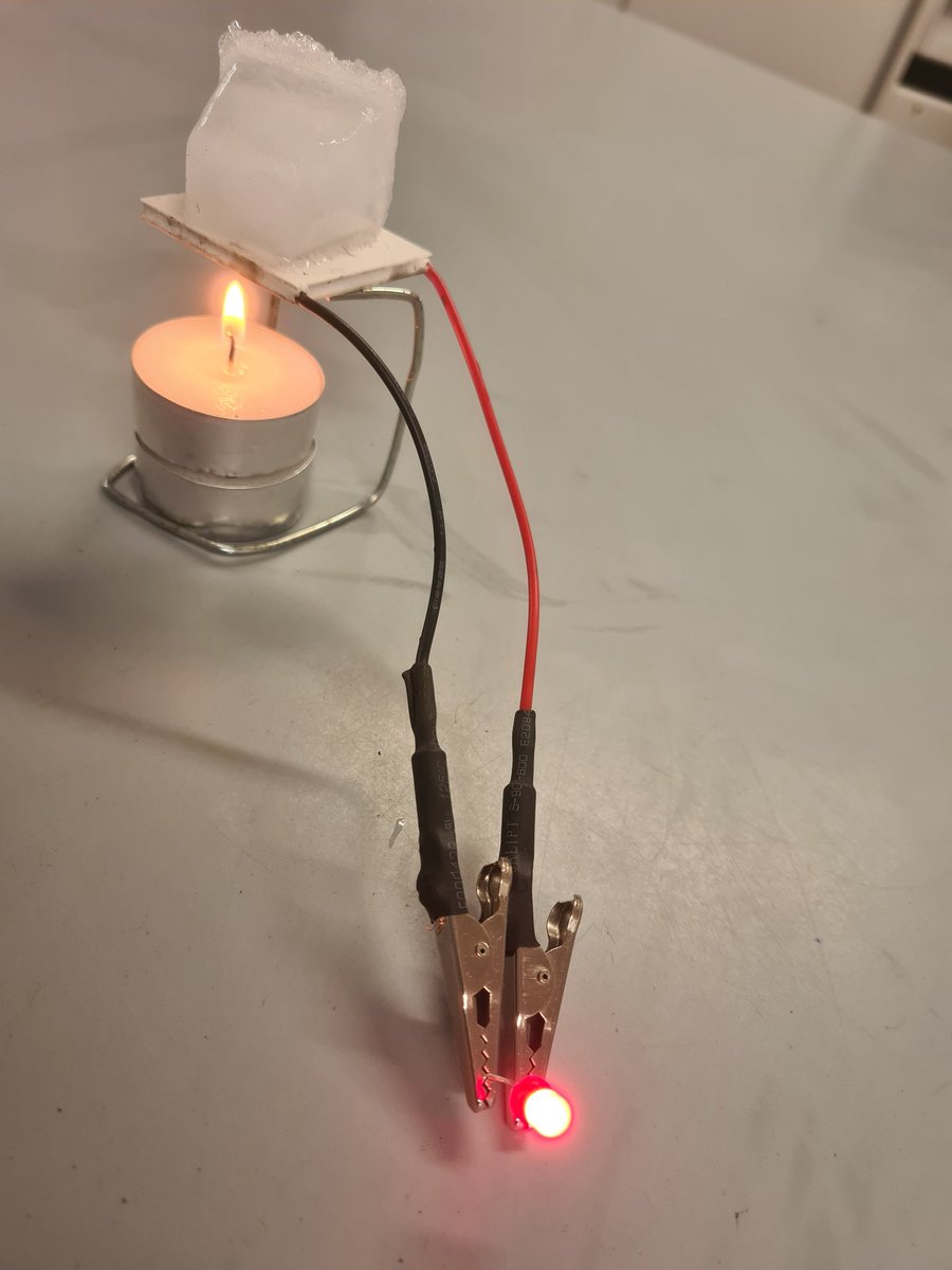 Mikekav66's tweet image. This is a peltier module. The temperature difference between the ice on top and the candle flame underneath generates enough current to light an LED. Application of Physics #jcscience #PW4