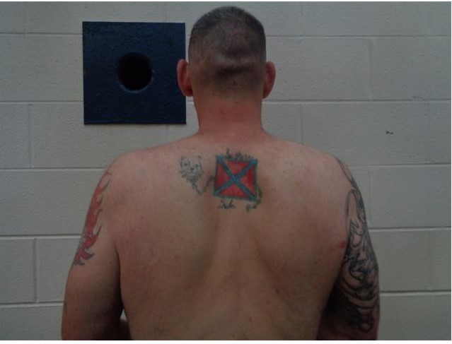 Tattooed white male back.