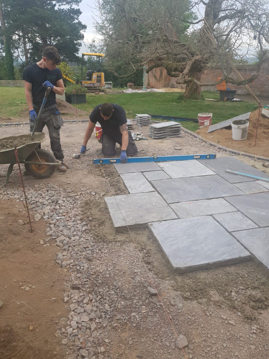 NLL_Ltd's tweet photo. The team are working hard transforming another domestic garden in Tilford. We love the way the tumbled black sandstone compliments the style of the building. The sandstone was provided by @_londonstone #SandstonePaving #LondonStone #Paving #HardLandscaping #BlackSandstone https://t.co/cP0XMiEMx7