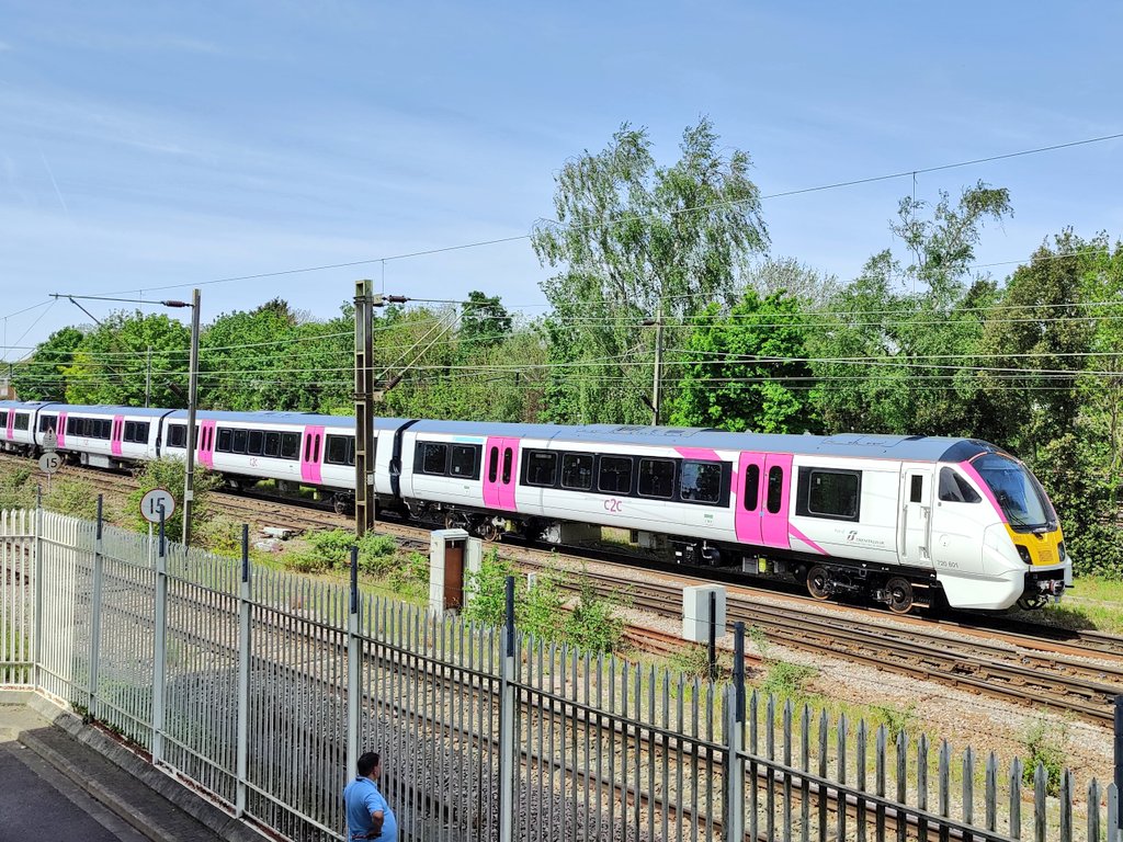 ChrisCockram's tweet image. New shiny @c2c_Rail train on test gliding through Upminster. Wonderfully quiet, and beautifully pink. #Class720