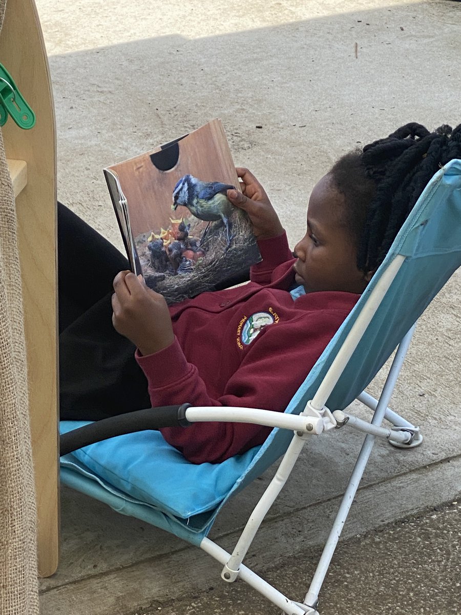 One of our Reception children just enjoying a relaxing afternoon reading outside. 😎 @beckywalker306 @WNAT_Home