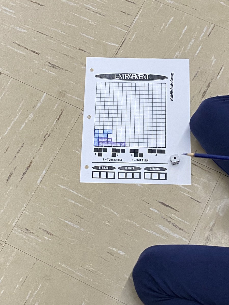 VicMartin33's tweet photo. Today’s math game is a variation of Tetris. Students need to use translations, reflections, and rotations to fill in the grid. The last person to add a shape wins. #mathgamefriday @HolyFamilyWdstk https://t.co/jErMnnsGvC