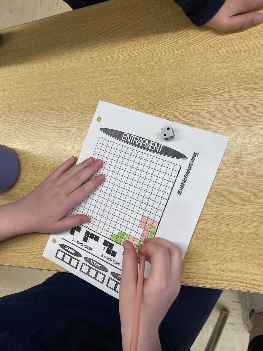 VicMartin33's tweet photo. Today’s math game is a variation of Tetris. Students need to use translations, reflections, and rotations to fill in the grid. The last person to add a shape wins. #mathgamefriday @HolyFamilyWdstk https://t.co/jErMnnsGvC