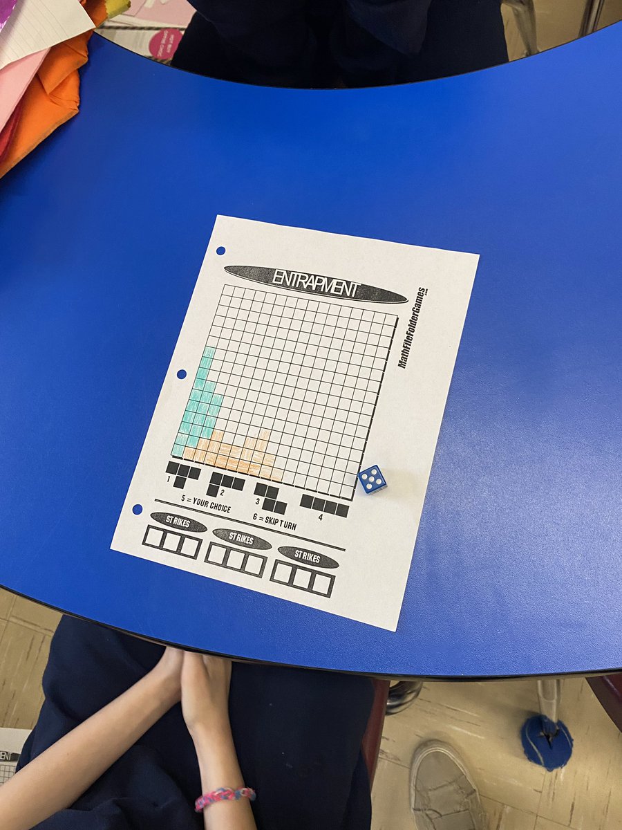 VicMartin33's tweet photo. Today’s math game is a variation of Tetris. Students need to use translations, reflections, and rotations to fill in the grid. The last person to add a shape wins. #mathgamefriday @HolyFamilyWdstk https://t.co/jErMnnsGvC