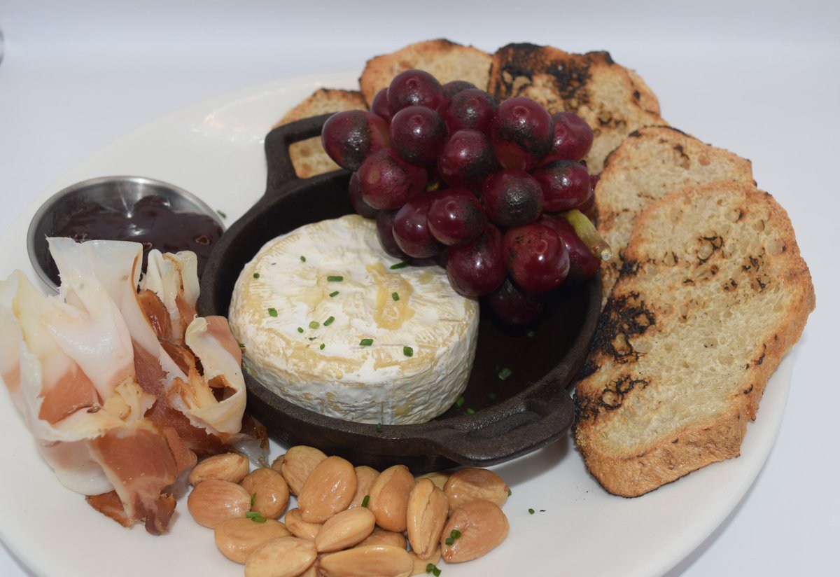 Chef Barnhart has once again created some amazing dishes for the spring menu. Stop in and try his Baked Camembert- a petite wheel of creamy French camembert cheese | smoked speck ham | marcona almonds | charred grapes | strawberry conserve | grilled baguette.