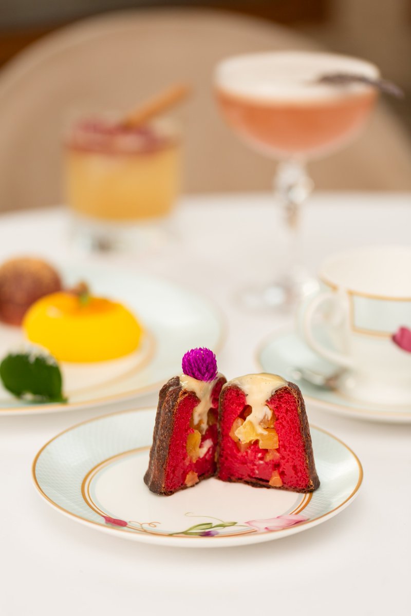 Take a trip to Dominica with our canelé’s bright red centre. Filled with a pineapple &amp; pink peppercorn jam, topped with a dulce de leche Chantilly, and finished with lime zest 🤤 Exclusively part of our Platinum Afternoon Tea.