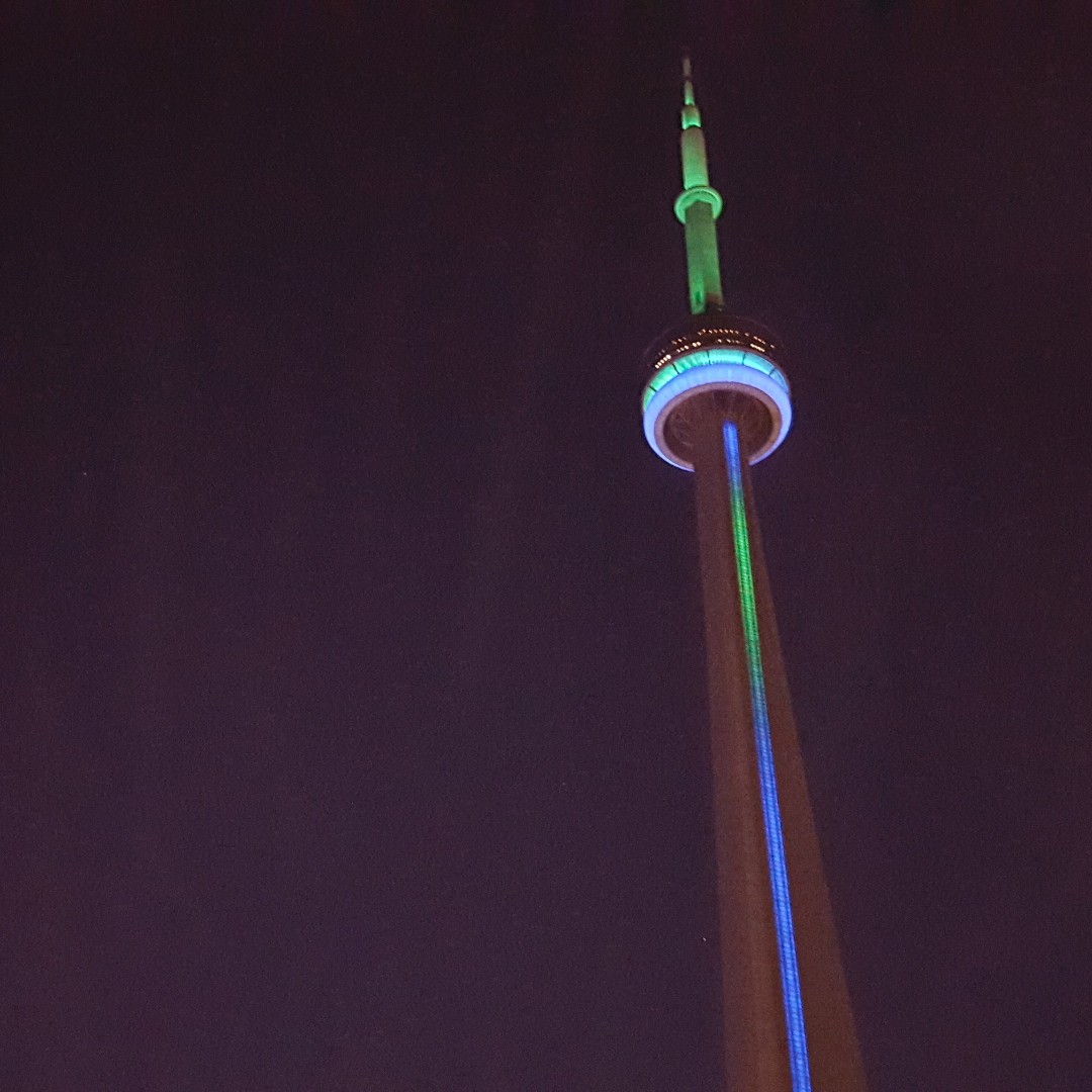 CLToronto's tweet photo. Our colours - a powerful symbol of inclusion - will be shining tonight! Here in TO, both the @TourCNTower & the Toronto sign at @npstoronto will be lit up in blue & green to show our city's support for #CLMonth. 💚💙 #CLInspiringPossibilities @CLOntario @cityoftoronto #TONews https://t.co/r02lGJdnI4