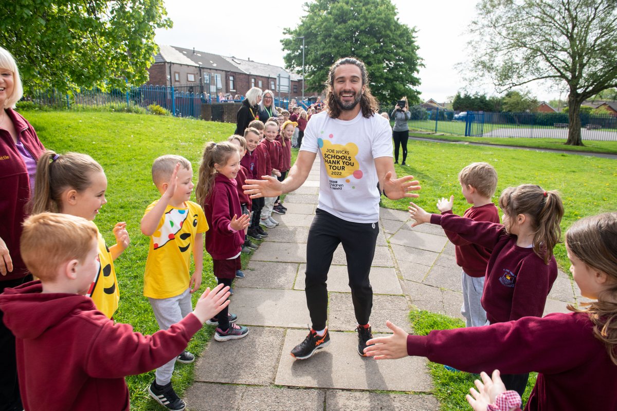 WiganCouncil's tweet photo. Children @rlhughesAIM had a special visit from Joe Wicks MBE today, who called in as part of his @BBCCiN Thank You Tour to celebrate schools' fundraising. Joe led a workout to encourage positive mental wellbeing. Looks fantastic! Thanks for visiting the borough, Joe @thebodycoach https://t.co/Vu7Hf5jpo7