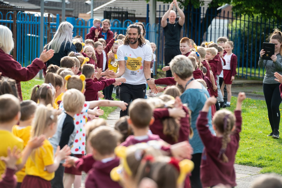WiganCouncil's tweet photo. Children @rlhughesAIM had a special visit from Joe Wicks MBE today, who called in as part of his @BBCCiN Thank You Tour to celebrate schools' fundraising. Joe led a workout to encourage positive mental wellbeing. Looks fantastic! Thanks for visiting the borough, Joe @thebodycoach https://t.co/Vu7Hf5jpo7