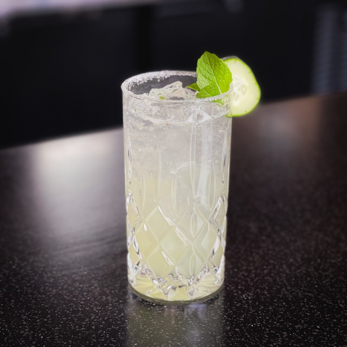 We have a spring twist on the traditional mojito with cucumber and lavender. 🥒 Dream of basking in the sun with this rum cocktail. Stop downtown to Enbär Craft Cocktail Lounge and get one.