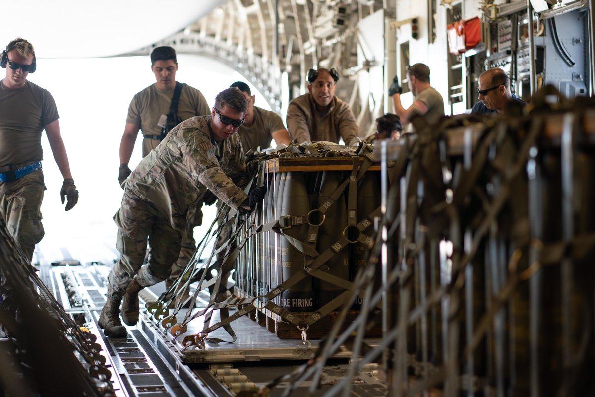 DeptofWar's tweet photo. .@USAirForce Airmen secure packages of 155 mm howitzer rounds for shipment to Ukraine at Travis Air Force Base in April 2022. https://t.co/56WqfkSbDB