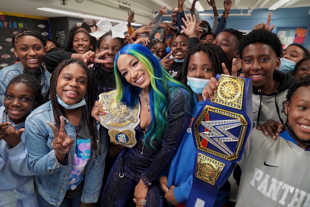 WWE's tweet photo. School was in session with The Boss at KIPP AMP Middle School in Brooklyn ahead of #SmackDown!

@SashaBanksWWE https://t.co/Qj0ZjGGJXI