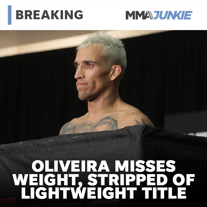 MMAJunkie's tweet photo. #BREAKING: Charles Oliveira officially comes in .5 pounds over the lightweight limit after his second try. He's forced to vacate the title and can't win it back at #UFC274. Justin Gaethje remains eligible to become champion. 

Full results: https://t.co/pBiaYrG48i https://t.co/SqxNF8KutT