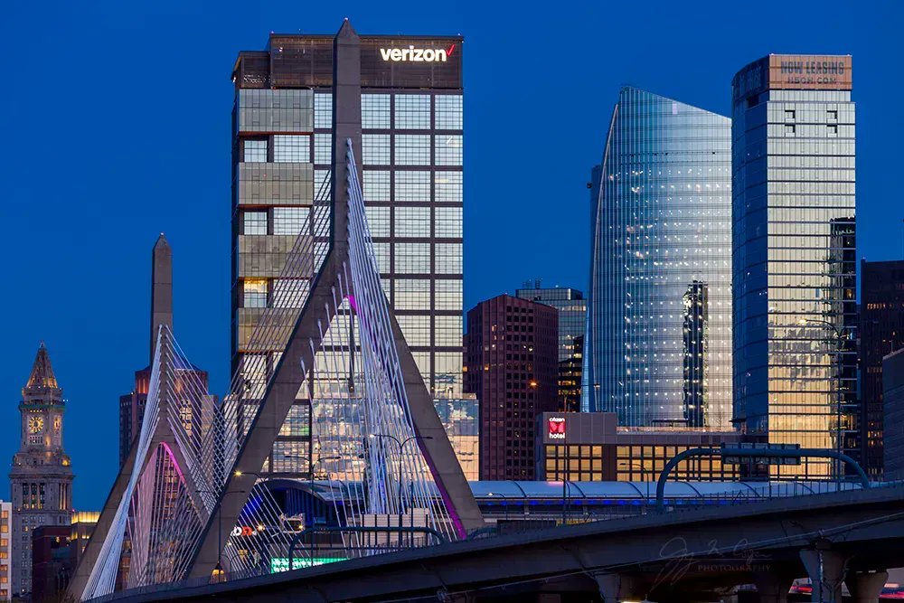 gmcphoto's tweet photo. The sunset is reflected in downtown Boston buildings with the Leonard P. Zakim Bridge in the foreground.  

@CanonUSAimaging @OnlyInBOS 
@CityOfBoston https://t.co/4jLIacQKES