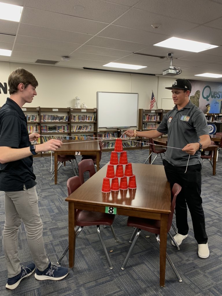 LGuerrero_MET's tweet photo. For Students Helping Students this week, we taught an activity where the kids had to stack cups using rubber bands and string! #PeoriaMET #PeoriaMETENG https://t.co/iu00Q5dSg3
