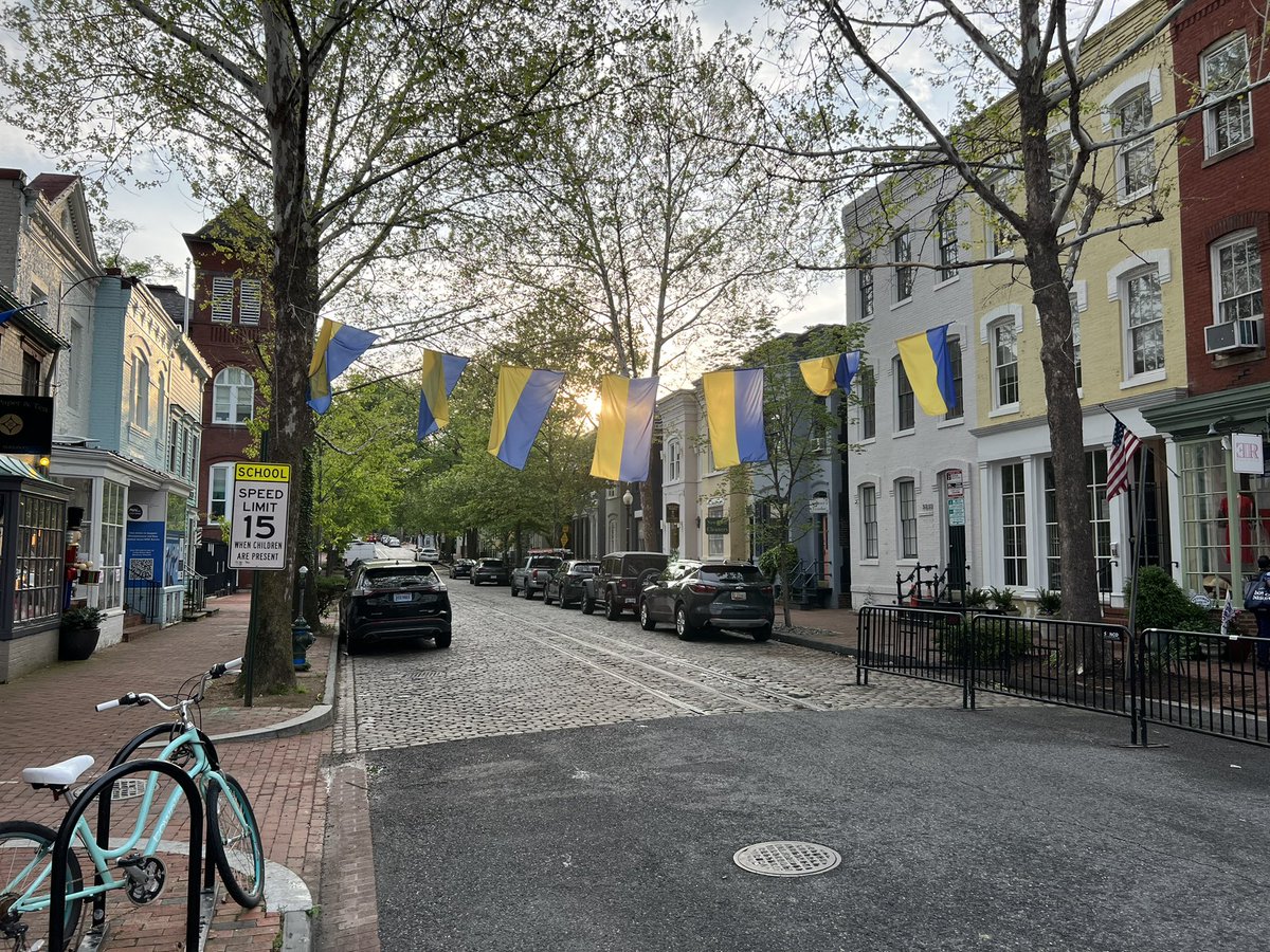 MaxBlumenthal's tweet photo. Affluent quarters of Washington DC are festooned with Ukrainian flags &amp; Zelensky is upheld as a warrior-sage. 

I’m these parts, there is no debate on the $33 billion military aid package, only the certainty that the money will come back home in the form of lucrative contracts. https://t.co/4xEykWzi9c