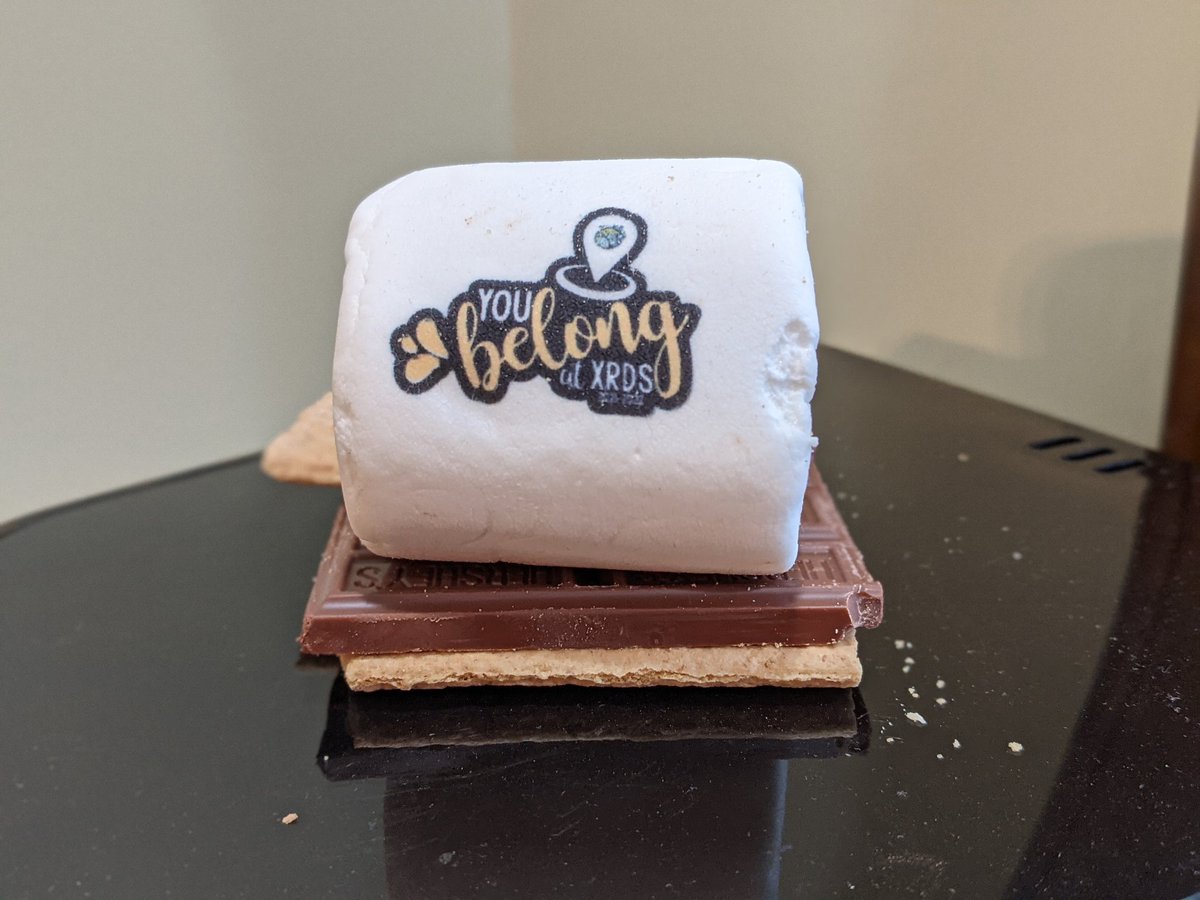 misteacher's tweet photo. And the crescendo! A personalized marshmallow with the school theme logo in edible ink. 🤯 Thanks for loving and leading @BonnieCapes Brody says thanks too 😘 #hardwork #heartwork #marshwork https://t.co/YSYTV3IN6Q
