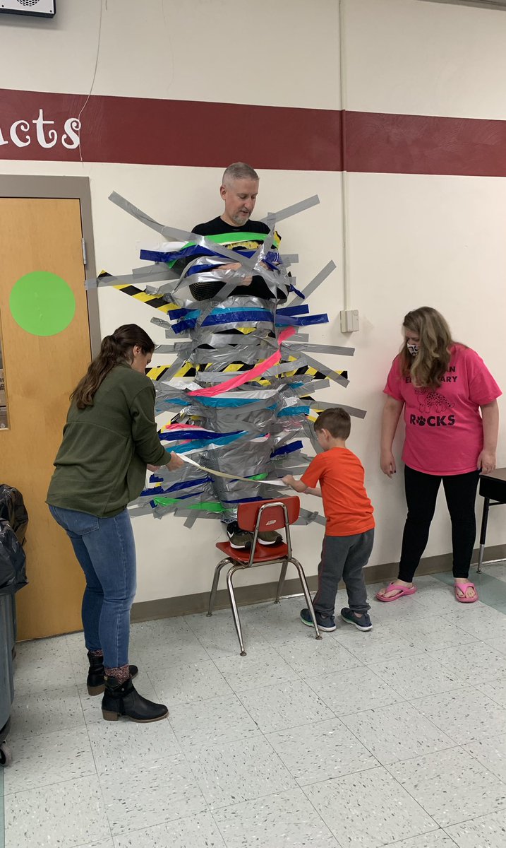 mrs_alloyd's tweet photo. Not everyday you get to help duct tape your principal to the wall!!! 😆 #WErTJ #WErTJK https://t.co/LDfn03NBxD
