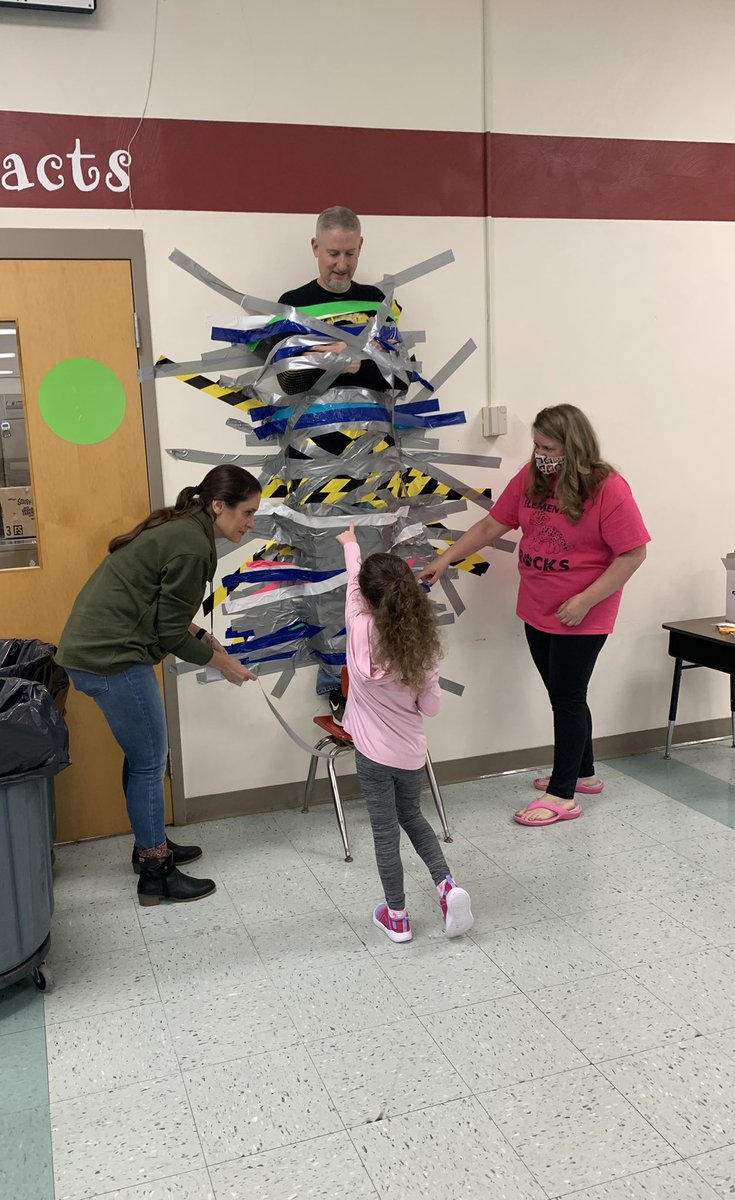 mrs_alloyd's tweet photo. Not everyday you get to help duct tape your principal to the wall!!! 😆 #WErTJ #WErTJK https://t.co/LDfn03NBxD