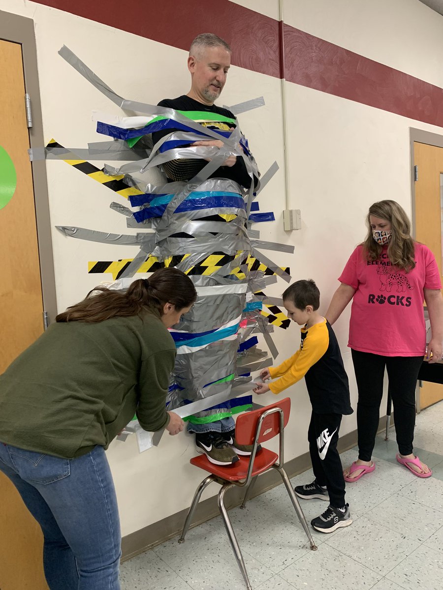 mrs_alloyd's tweet photo. Not everyday you get to help duct tape your principal to the wall!!! 😆 #WErTJ #WErTJK https://t.co/LDfn03NBxD