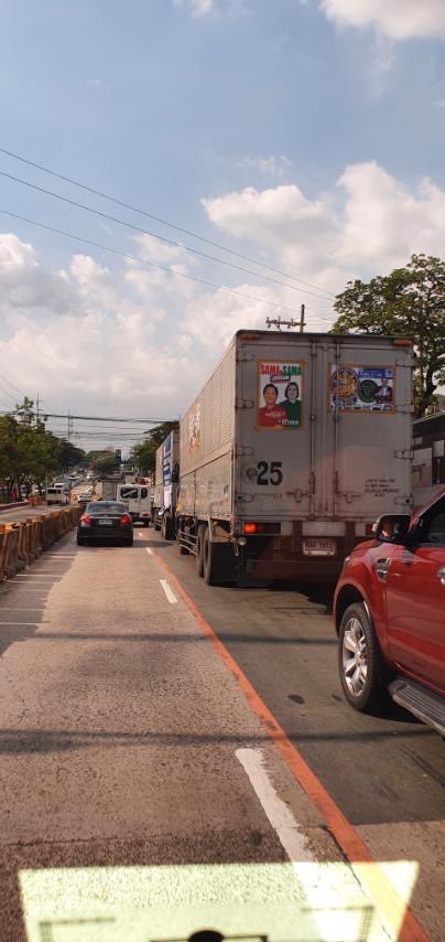 giasison's tweet photo. These vans are carrying ballot printouts why the stickers? #BantayBalota @COMELEC this is along Katipunan QC. https://t.co/BizJfzc5pB