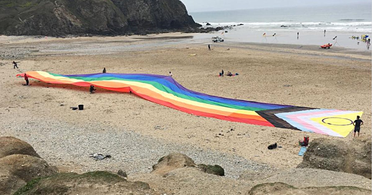 CornwallPride's tweet photo. Who's coming to march with the biggest Progress Pride flag on the Planet! 🏳️‍🌈 today #FalmouthPride 
#CornwallPride  #OneAndAll
#LoveWhoYouWantToLove #BeWhoYouWantToBe
Cornwall Pride! Onen hag oll (One and All) We are stronger together:

#CommunityPride #LGBTQ #LGBTQIA #UKPride50 https://t.co/InJlry0Umt