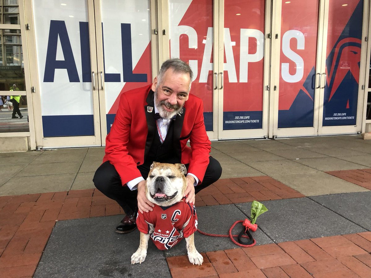 OvietheBulldog's tweet photo. IT’S PLAYOFF HOCKEY O’CLOCK! #ALLCAPS #LETSGOCAPS #ROCKTHERED #COACHSAFFYBEAN is ready! Some pics from 2018 and earlier from outside @CapitalOneArena  including the bromance of @WesJohnsonVoice &amp; Ovie 

.@SaffyBean is hoping for some #VictoryCookies #Game3 https://t.co/4VlfSJ1O5q