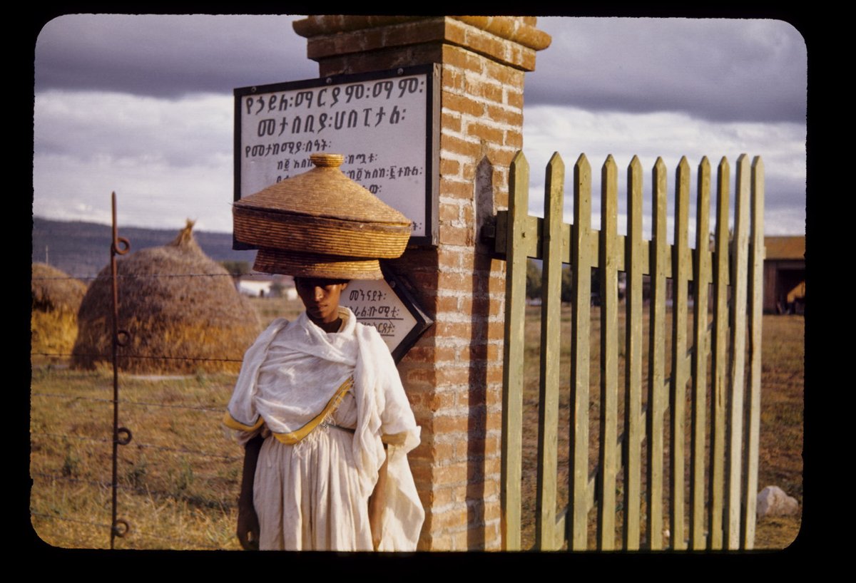 Woman with a basket of Injera visiting family at Haile Mariam Mamo Hospital, Nazareth 1948
