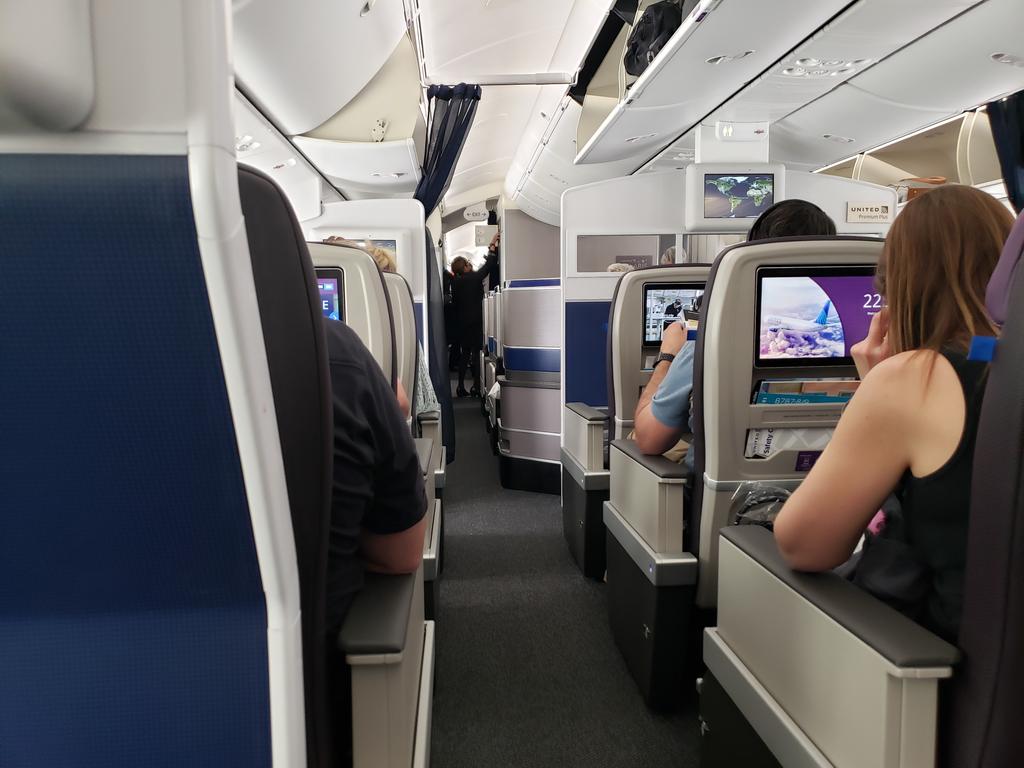 __b_c's tweet photo. #traytable third flight's the charm (still in economy, of course, but grateful for one of the best worst seats) https://t.co/mt9RbaXzQk
