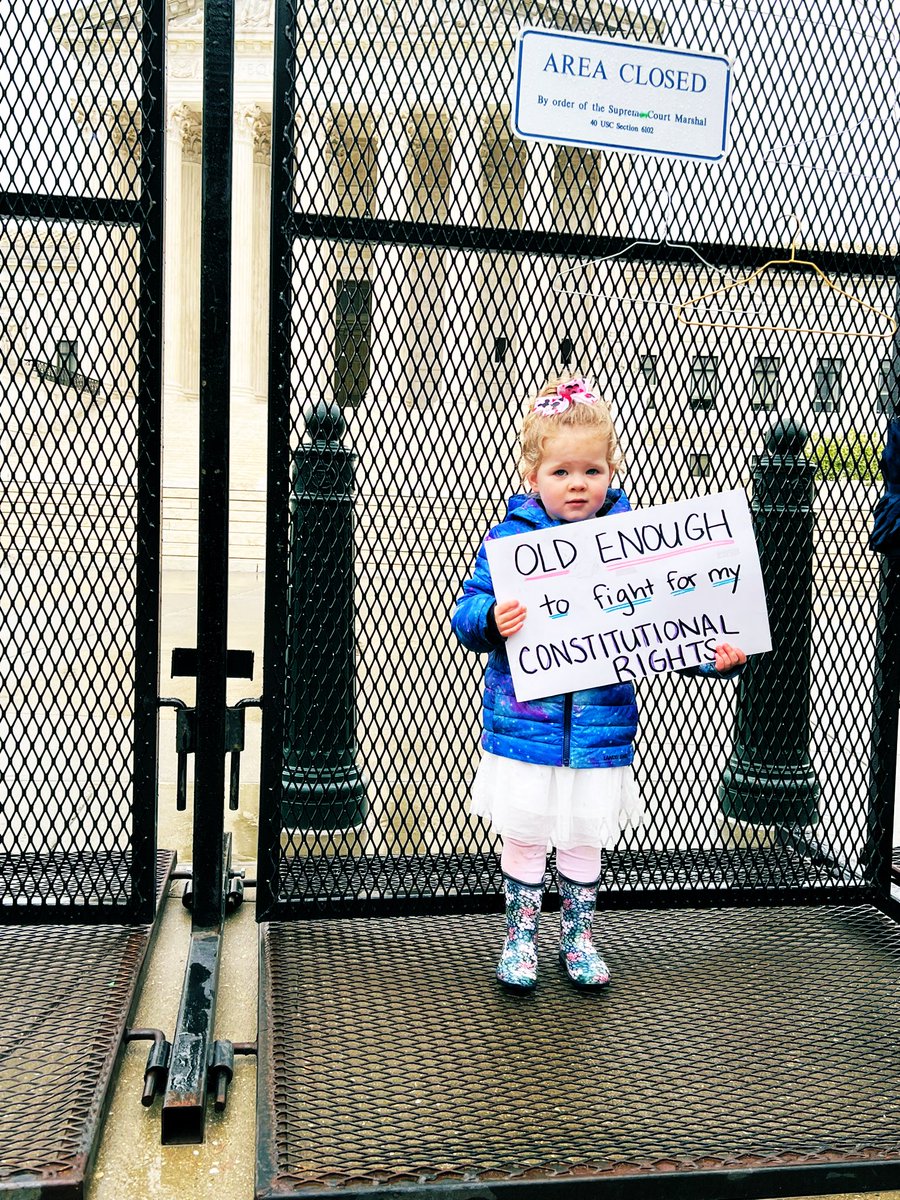 gabbyrichards's tweet photo. This little nugget is out here in the rain with her mom 😭 

#BansOffOurBodies https://t.co/dlW8DlUDgG