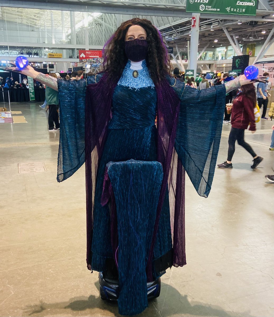 theizzEB's tweet photo. I had a fantastic time at #PAXEast cosplaying as Agatha Harkness from WandaVision! Everyone at the convention was so lovely and seemed really happy to see the character. I even dressed up my mobility device to make it look more like I was actually floating around. #WandaVision https://t.co/XW109XTnzu