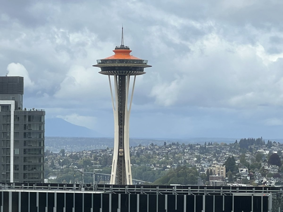 jasonrantz's tweet photo. I can’t be the only one who thinks painting the top of the Space Needle orange makes it look like the other thing we are known for in Seattle right? https://t.co/1ffb6HBiIl