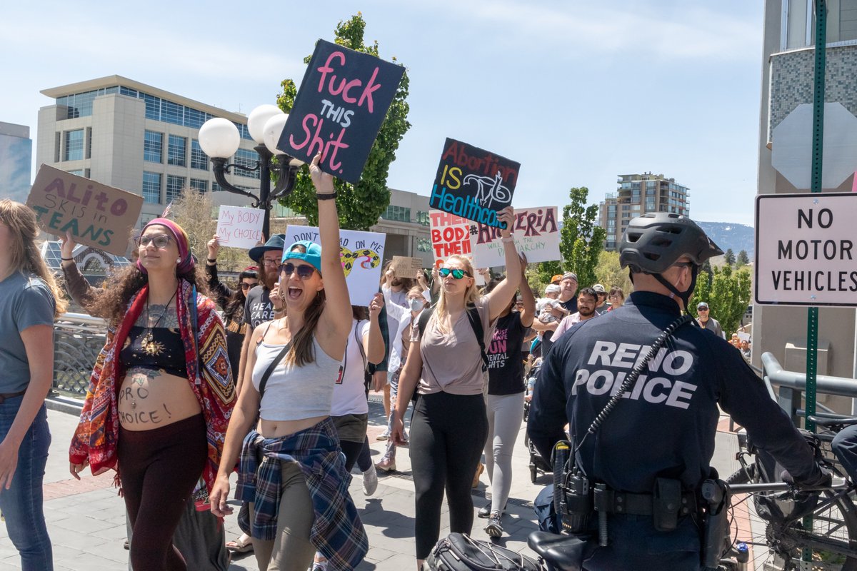 OurTownReno's tweet photo. As part of the #abortionrights protest in #Reno today there was also a short march with more powerful signs. Photos by @jakelorgee https://t.co/DrOnflcboc