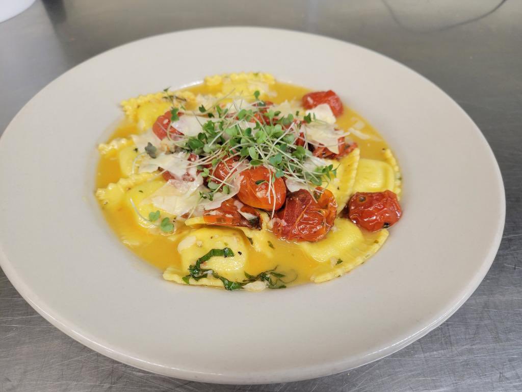 Mothers Day Specials:
Pan roasted cod loin over roasted fingerling potatoes and asparagus, finished with a saffron scented soubise sauce.
Kale and Parmesan ravioli, blistered cherry tomatoes, fresh basil, and finished in a white wine butter sauce.