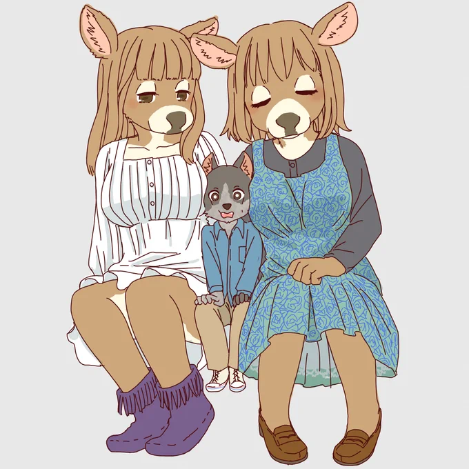 挟まれる牧牛犬 