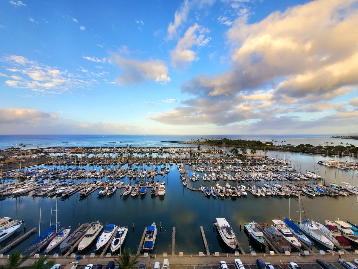 QuinnBurlingame's tweet photo. The sun is rising over the Ala Wai boat harbor in Honolulu. Day 1 of #S22MRS here we go! Come check out session EN04 at 10:00 in 321A for tutorial lectures by Prof. Koen Vandewal and myself on energy loss in #OPV's and #TransparentPhotovoltaics. https://t.co/cuq8rYRrCk