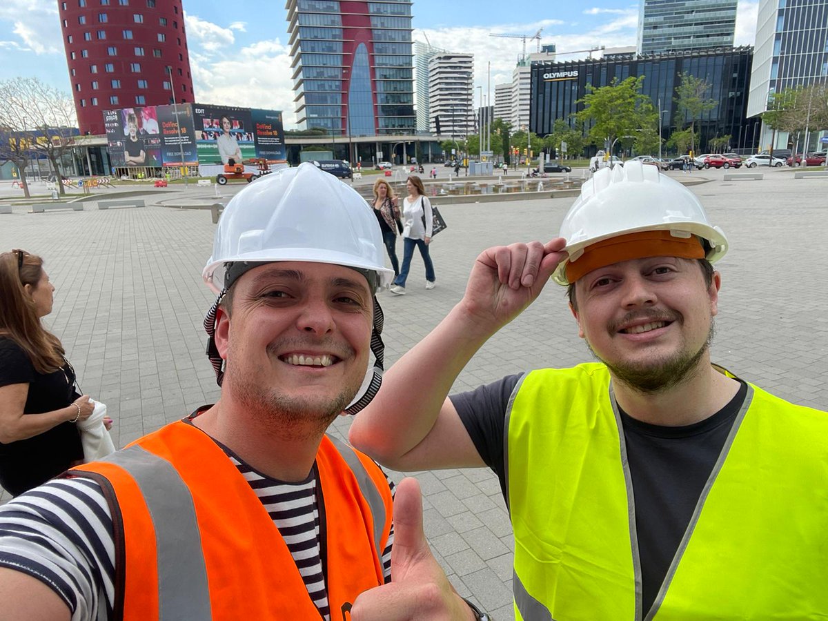 VisionAV's tweet photo. Those hard hats suit you Sam Dijs and Clement Goalic. #avtweeps #ise2022 #visionav #thebigbuild https://t.co/adYl3lqZZe