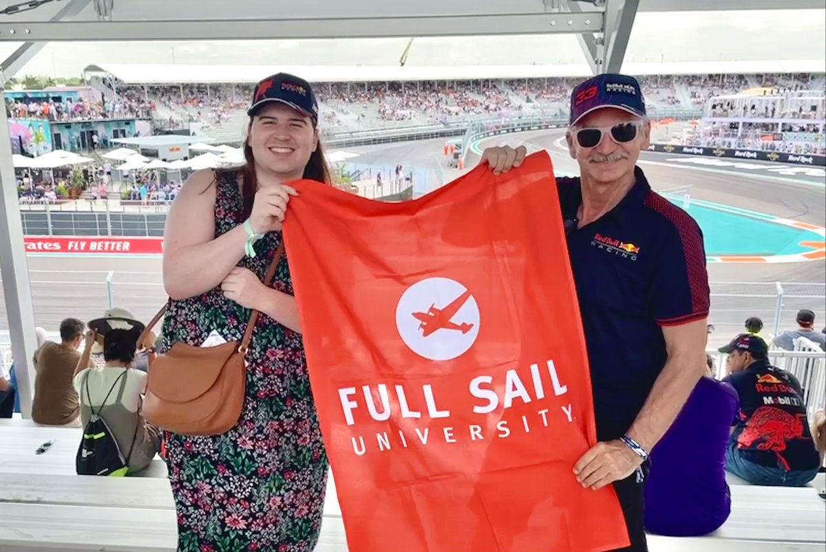 FullSail's tweet photo. Pat Starice and the Sim Viz program's newest alumna, Quinn, took a break from the life-sized #F1 3D Printed #RaceCar project and headed south, invited by @redbullracing, to the @f1miami for today's big race. #MiamiGP #FullSail #SimViz #RedBull #3DPrint https://t.co/LeJBeLQCB3
