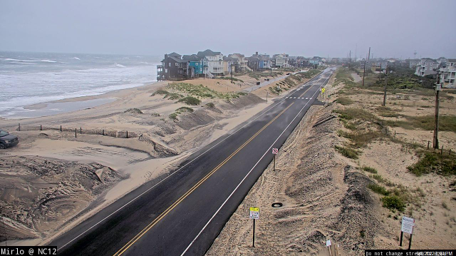 NCDOT_NC12's tweet photo. Our road crews are reporting that NC12 remains passable at this hour, with heavy 38-40 mph winds and sand blowing across the road throughout Pea Island. The next high tide is at 2 a.m., and we'll have crews checking conditions then. If you must go out, please drive with caution! https://t.co/9wIY9Op9PP